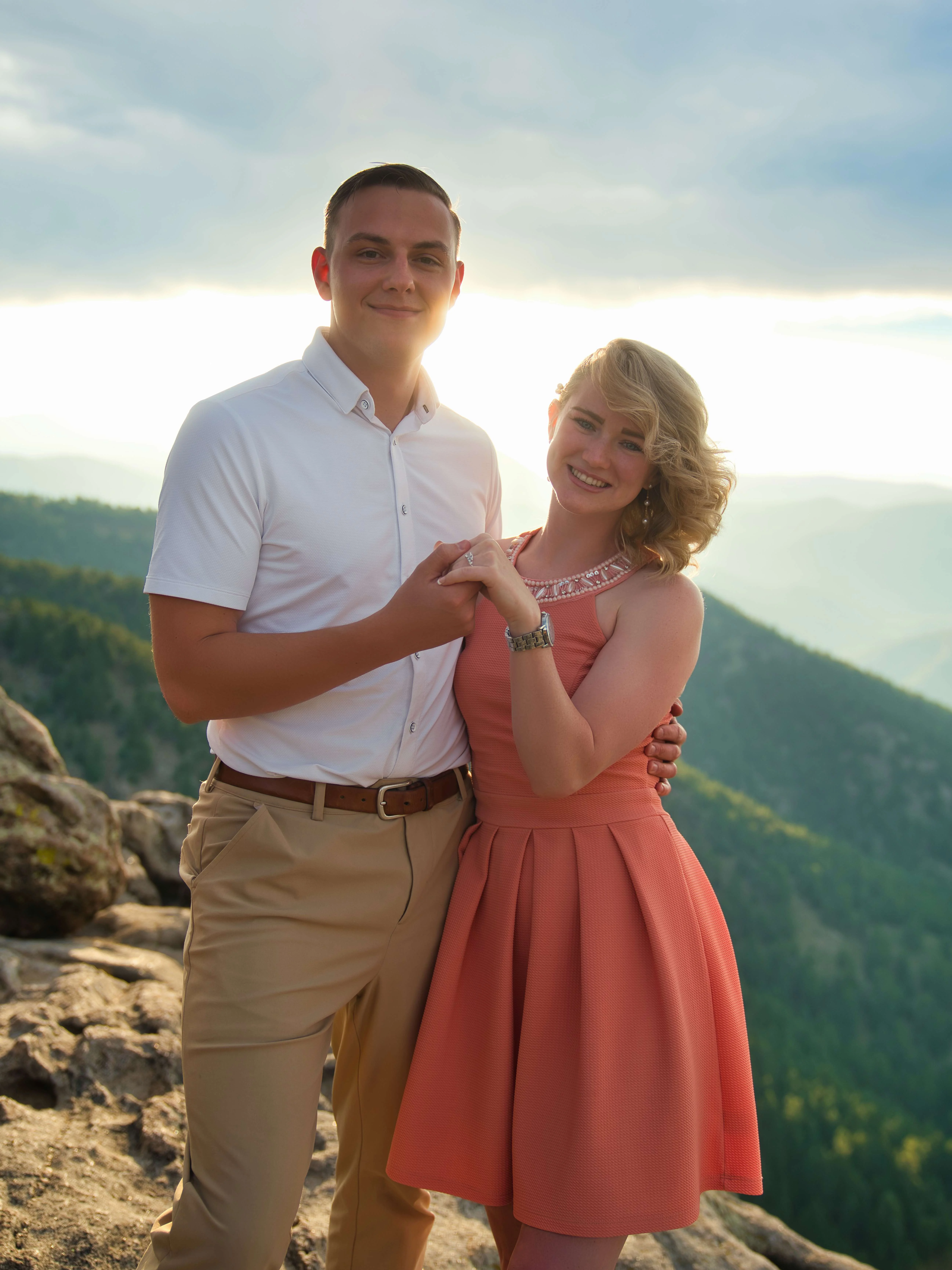 Romantic Mountain Overlook Engagement Photos Newly engaged couple embracing on mountain ridge, Denver engagement photography session
