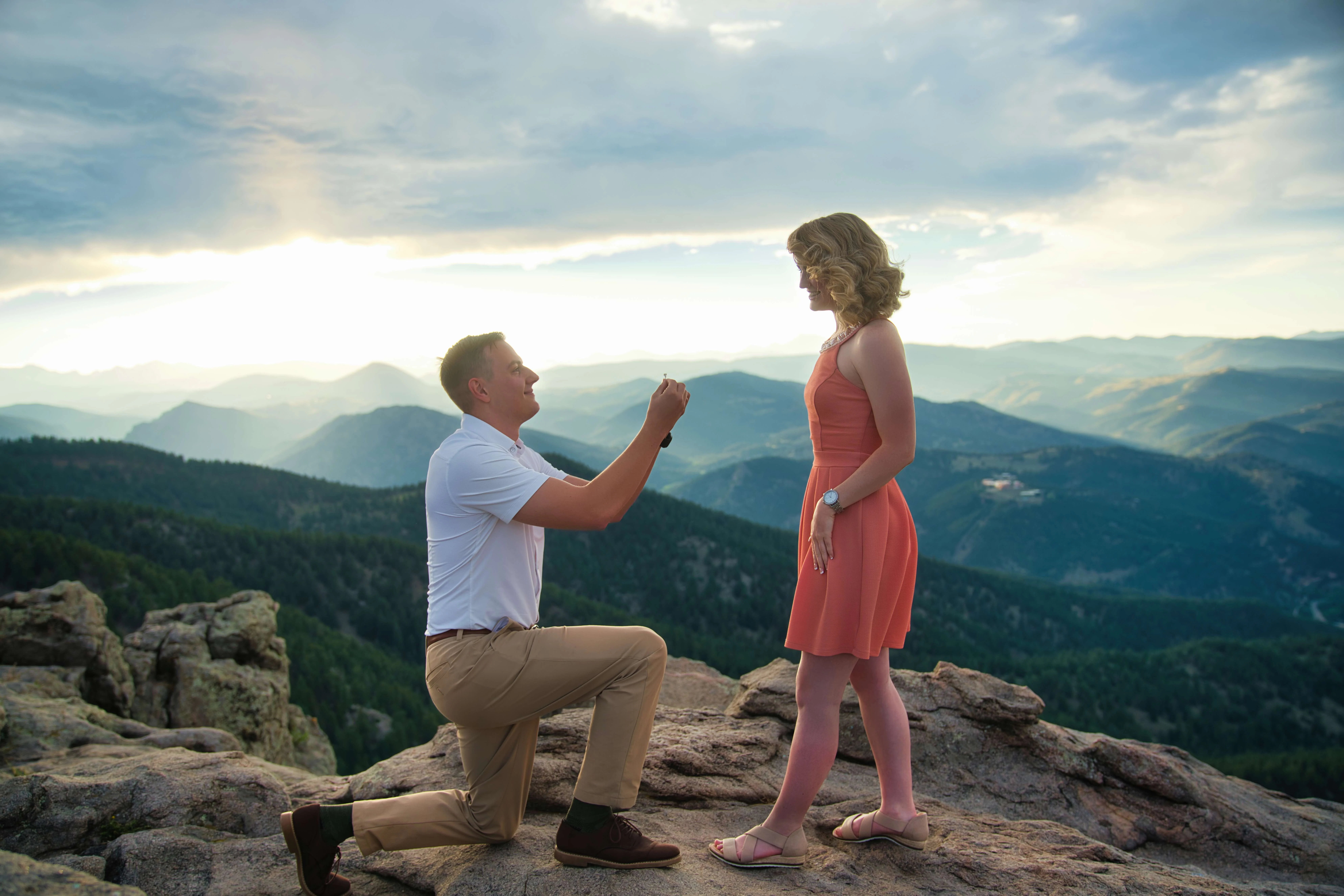 Sunset Proposal Photography in the Colorado Mountains Man proposing to girlfriend on mountain summit at sunset, Colorado engagement photoshoot
